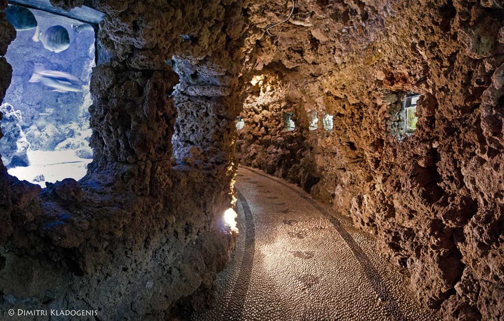 Rock-walled tunnel inside the Rhodes Aquarium
