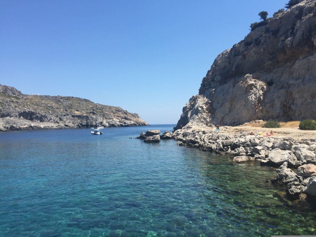 Rocky coastline and turquoise water at Anthony Quinn Bay, Rhodes